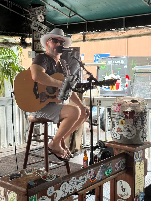 Jacin Neil Waple singing on stage
