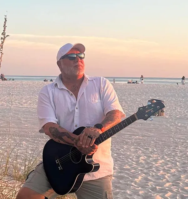 Jay Gurley performing solo acoustic with his guitar