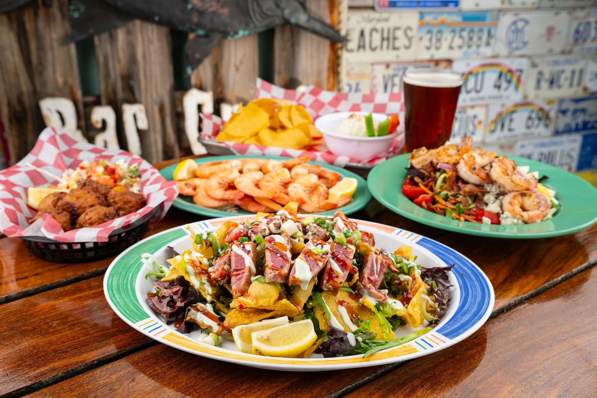 Some of our dishes, shrimp, conch fritters, tuna nachos and more on the dockside table